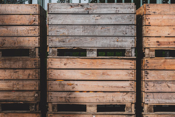 Wooden storage crates on rows. Old storage wooden bins