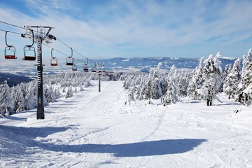 chair lift on mountain for downhill skiers