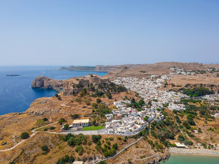 Aerial birds eye view drone photo of village Lindos, Rhodes island, Dodecanese, Greece. Sunset...