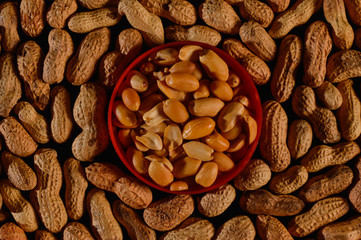 Peanut in a shell texture,background of peanuts with a plastic plate