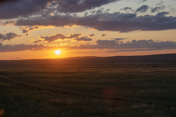 Sunny sunset in the steppes of Kazakhstan.