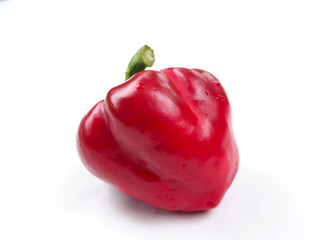 Ripe red sweet pepper on white background
