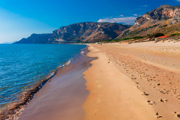 Panoramic sea beach landscape near Gaeta, Lazio, Italy. Nice sand beach and clear blue water. Famous tourist destination in Riviera de Ulisse. Bright sunny light and sunset.