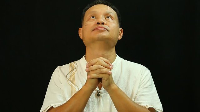 Thai man praying   with black background