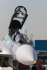 An opening empty cabin of the jet fighter
