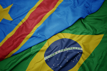 waving colorful flag of brazil and national flag of democratic republic of the congo.