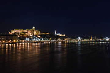 Obraz na płótnie Canvas Night view of Budapest. Cityscape of famous tourist destination with Danube and bridges. Travel illuminated landscape in Hungary, Europe.