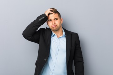 Young handsome caucasian man being shocked, she has remembered important meeting.