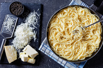 hot spaghetti mixed with grated pecorino cheese
