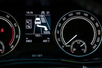 Fototapeta premium Car's dashboard shows automated parking instructions