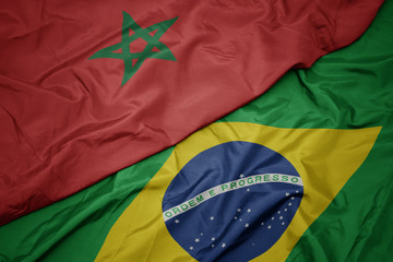 waving colorful flag of brazil and national flag of morocco.