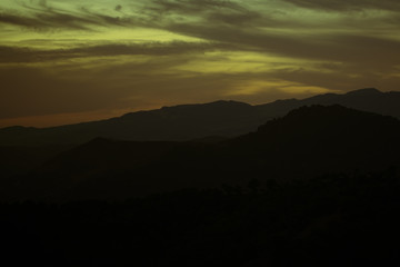 Green and yellow shades of clouded sky