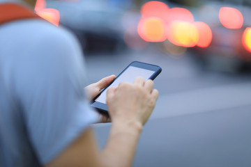 People use smartphone on night street