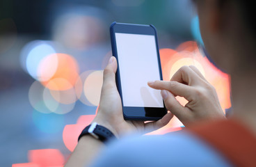People use smartphone on night street