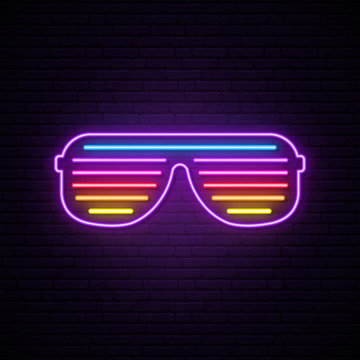 Neon shutter glasses sign. Bright vector sunglasses illustration in retro 80s style.
