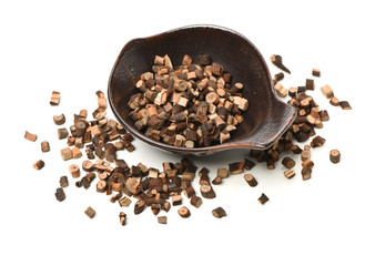 Cinnamon twig chinese herbal medicine on a white background pestle over white background. Gui zhi.