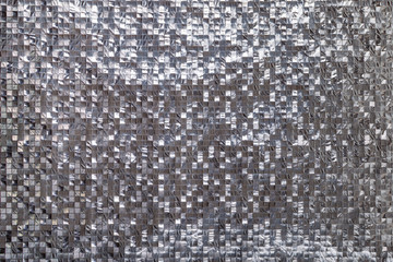 Silver metallic Squared three-dimensional background. Shiny 3d metal silver foil texture