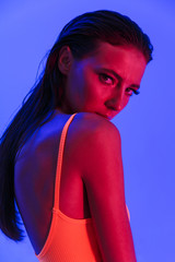Image of pretty caucasian woman wearing bodysuit underwear posing at camera