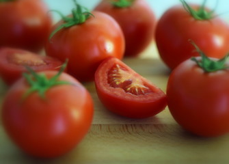 tomatoes on wooden board