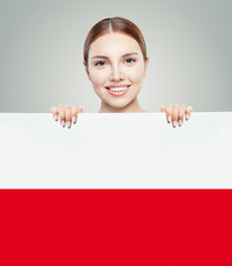 Cute woman showing the Poland flag background. Travel and learn