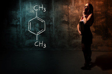 Sexy girl or secretary or female student presenting handdrawn chemical formula of Xylene