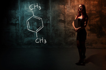 Sexy girl or secretary or female student presenting handdrawn chemical formula of Xylene