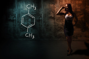 Sexy girl or secretary or female student presenting handdrawn chemical formula of Xylene