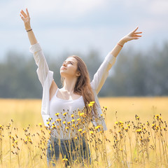 happy girl in autumn field with spikelets landscape / adult young girl portrait, summer look, nature