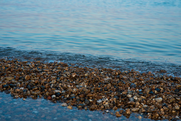 Colourful water and pebbles 