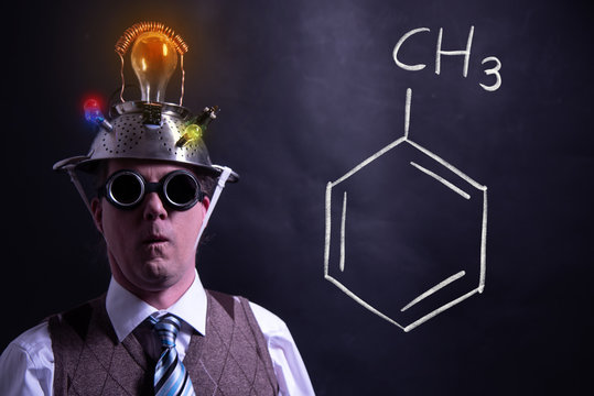 Nerd presenting handdrawn chemical formula of toluene