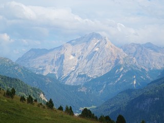Some peaks of the Dolomites immersed in the nature of the Val di Fassa, near the town of Canaze,...