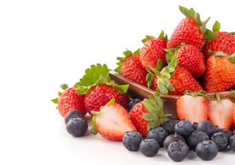 A bowl set of beautiful and delicious strawberry and blueberry isolated on white background, close up, copy space, clipping path, cut out.
