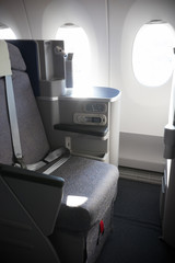 A business class clean cabin of the airplane - opened portholes