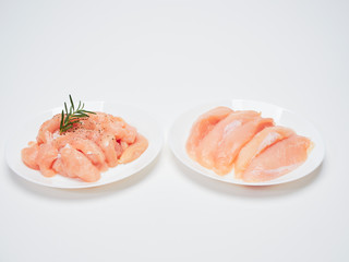 Fresh chicken tenderloin in white plate