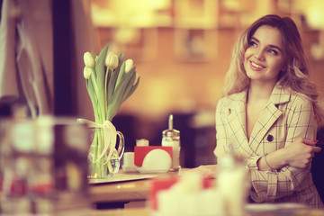 spring flowers bouquet / beautiful girl with spring flowers of white tulips, happiness, wedding, holiday