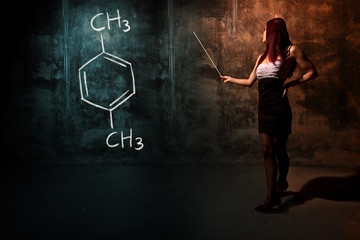 Sexy girl or secretary or female student presenting handdrawn chemical formula of Xylene