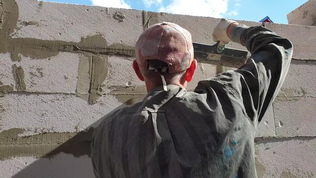 The construction of the building from the blocks.