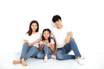Happy asian Young family Sitting On Floor