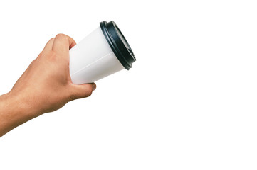 Isolated Takeaway cup, for Coffee, Tea in a guy s hand with a black cap. on a white background.
