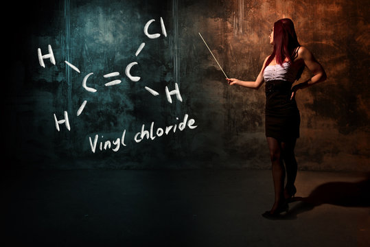 Sexy girl or secretary or female student presenting handdrawn chemical formula of vinyl chloride