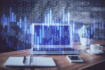 Double exposure of chart and financial info and work space with computer background. Concept of...