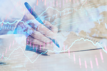 Forex chart displayed on woman's hand taking notes background. Concept of research. Double exposure