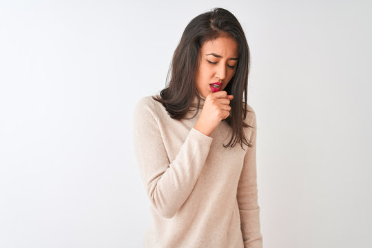 Beautiful chinese woman wearing turtleneck sweater standing over isolated white background feeling unwell and coughing as symptom for cold or bronchitis. Healthcare concept.
