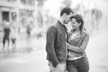 couple in love on a walk in Rome, Italy / young lovers hug, hug and love