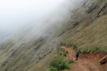 Young hiker man trekking with backpack in Peruvian Andes mountains, Peru, South America