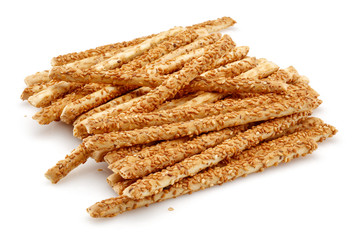 Sesame stick crackers or grissini isolated on white background