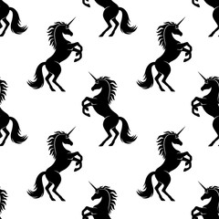 Seamless pattern with black unicorns on a white background.