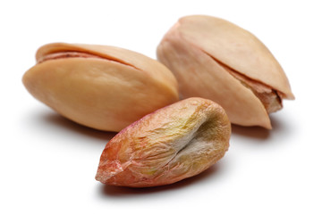 Fresh pistachio nuts isolated on white background