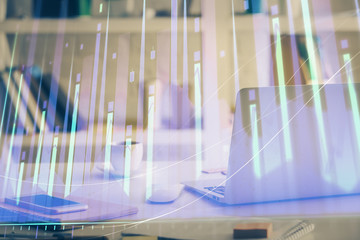 Stock market graph and table with computer background. Multi exposure. Concept of financial analysis.