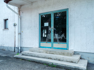 Closed entrance of small railway station © Andy Nowack